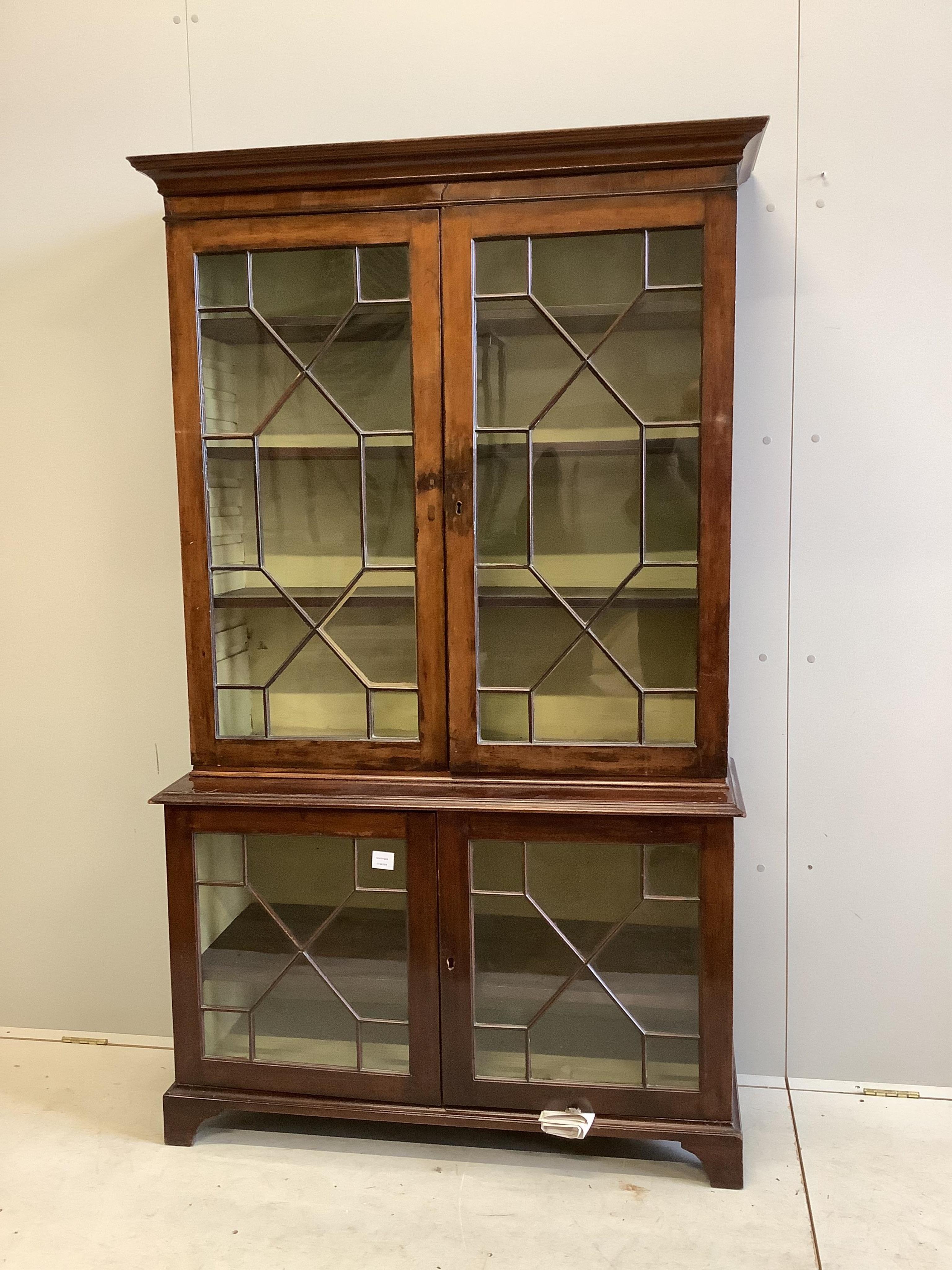 A George III style mahogany bookcase, width 112cm, depth 32cm, height 184cm. Condition - poor to fair